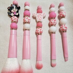 Pink cow themed hand beaded with silicone beads makeup brushes.
